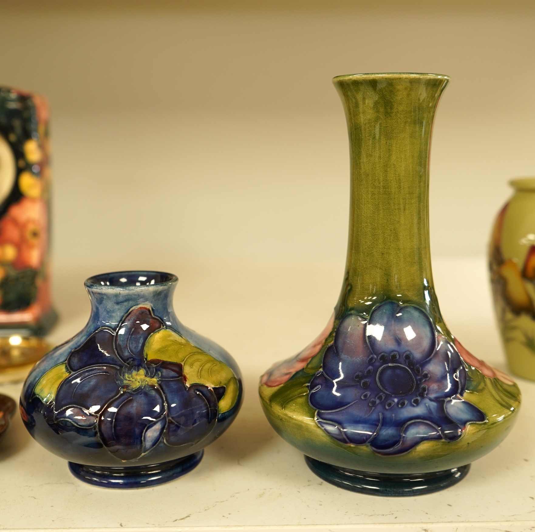 A collection of nine modern Moorcroft pieces including a Furzy Hill vase and a Toadstool vase, tallest 19cm